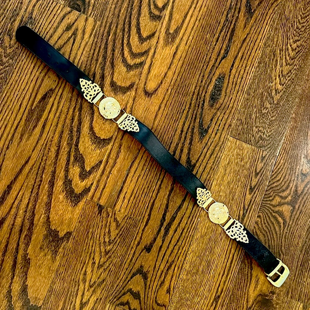 Black belt with gold medallions.